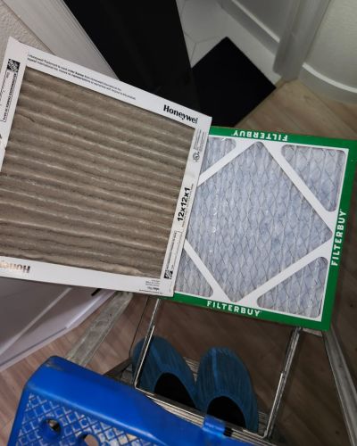 air filters from honeywell and filterbuy are placed on a ladder showing a replacement process for hvac systems
