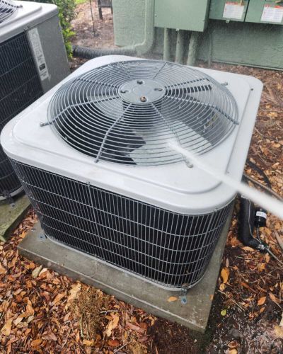 home therapist cooling heating and plumbing cleaning an outdoor air conditioning unit with water and possibly a cleaning solution