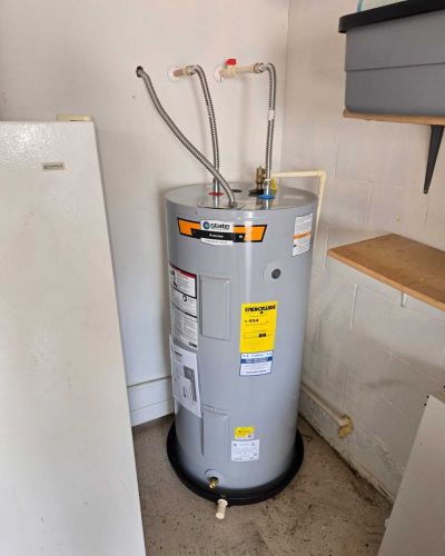Water Heater In Utility Room With Connected Pipes And Valves Tampa Fl