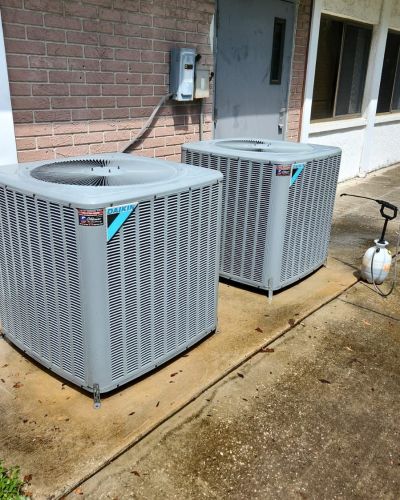 Air Conditioning Units Outside Building With Sprayer Tampa Fl