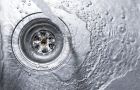 Flowing Water Draining Into Sink Drain With Bubbles