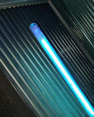 Blue Neon Light Tube In Dark Background With Metal Surface Tampa Fl