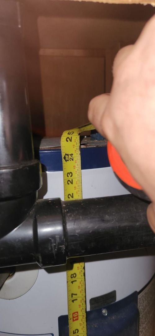 measuring plumbing components using a tape measure for accurate installation or repair of a system