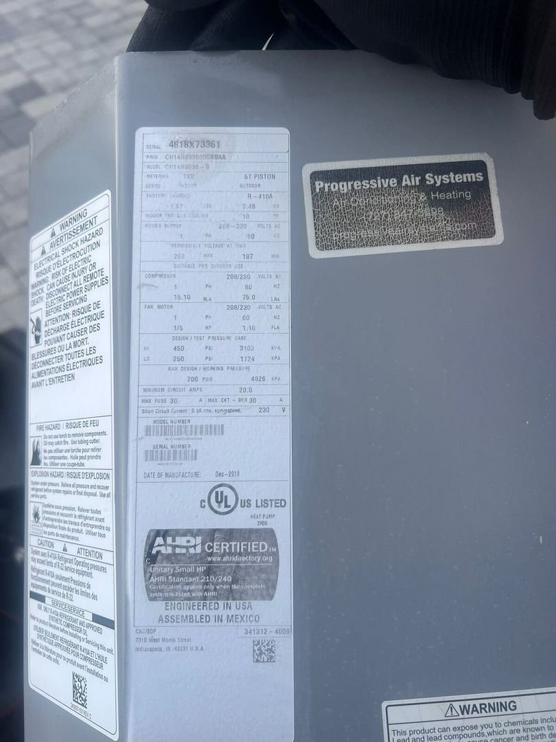 Information Label From An Air Conditioning Unit Detailing Specifications And Certifications