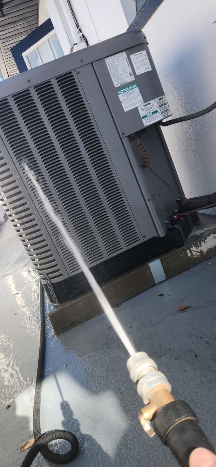 AC maintenance visit in Seminole, FL 33772 showing indoor unit inspection