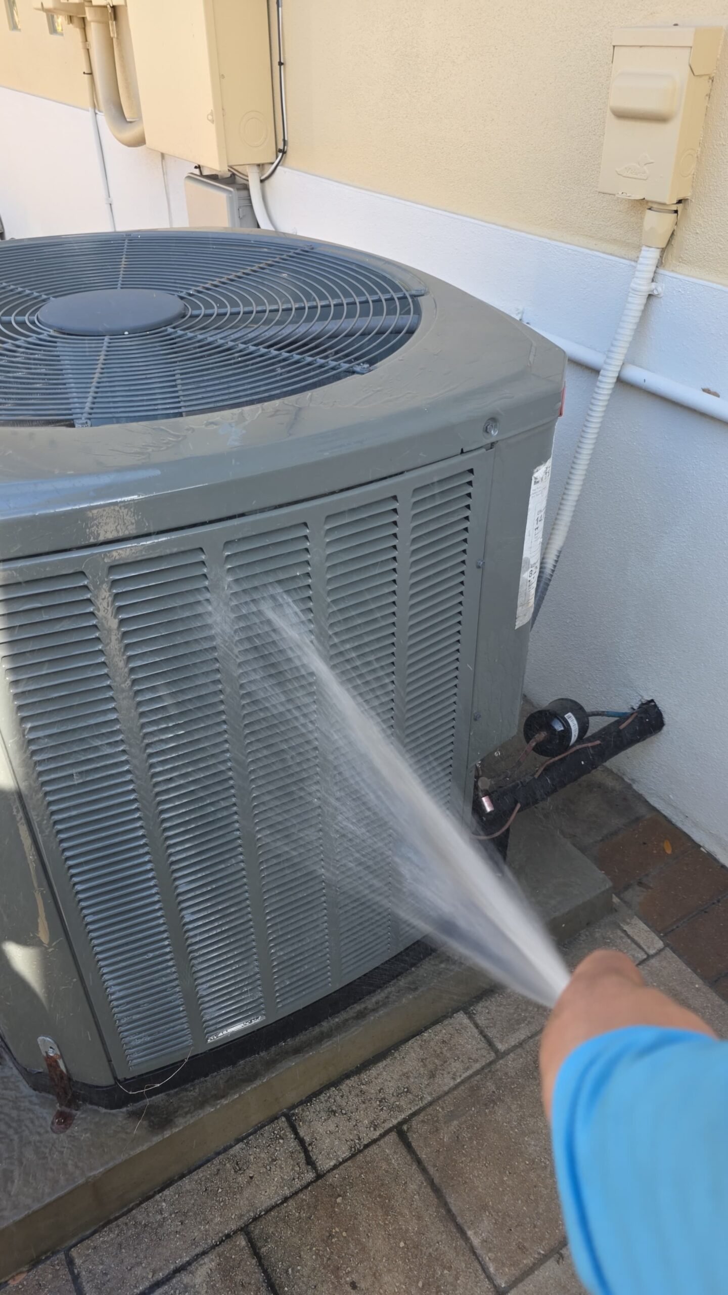 Checking pressures during AC tune-up service in Tampa, FL 33629