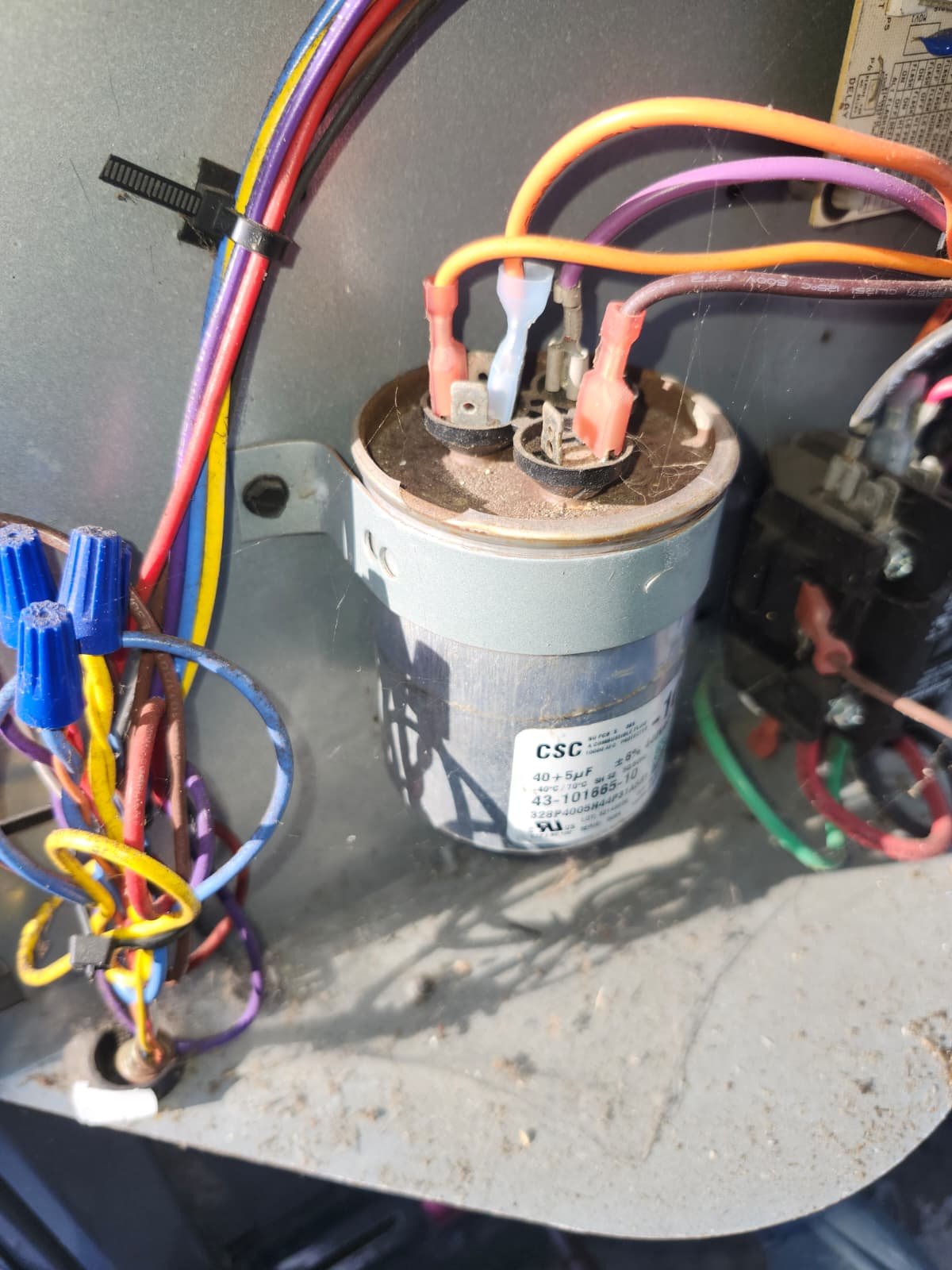 Close-up of new HVAC capacitor wiring during repair in Lutz, FL 33549