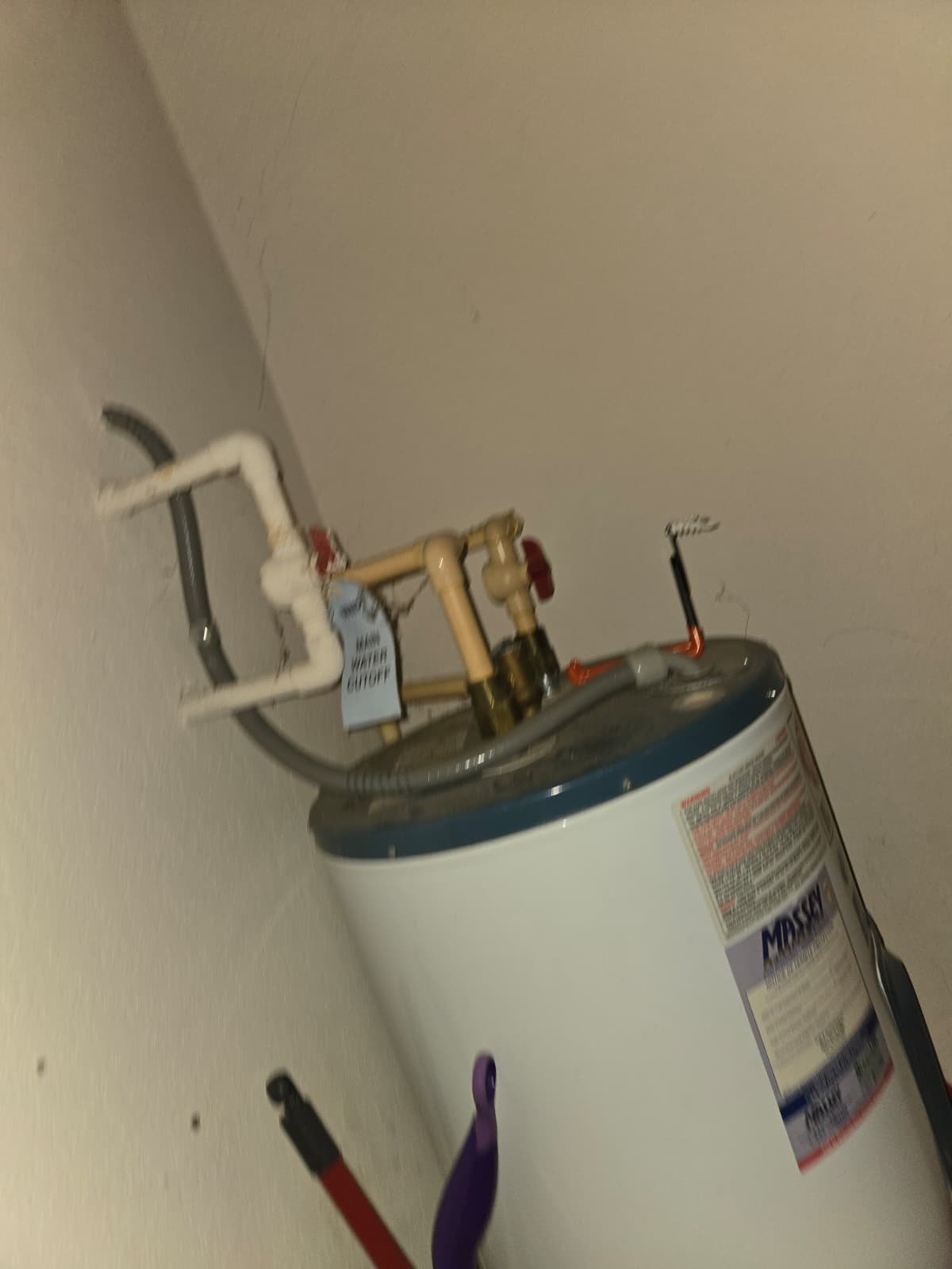 Old 2005 water heater inspected during plumbing evaluation in Riverview, FL 33578