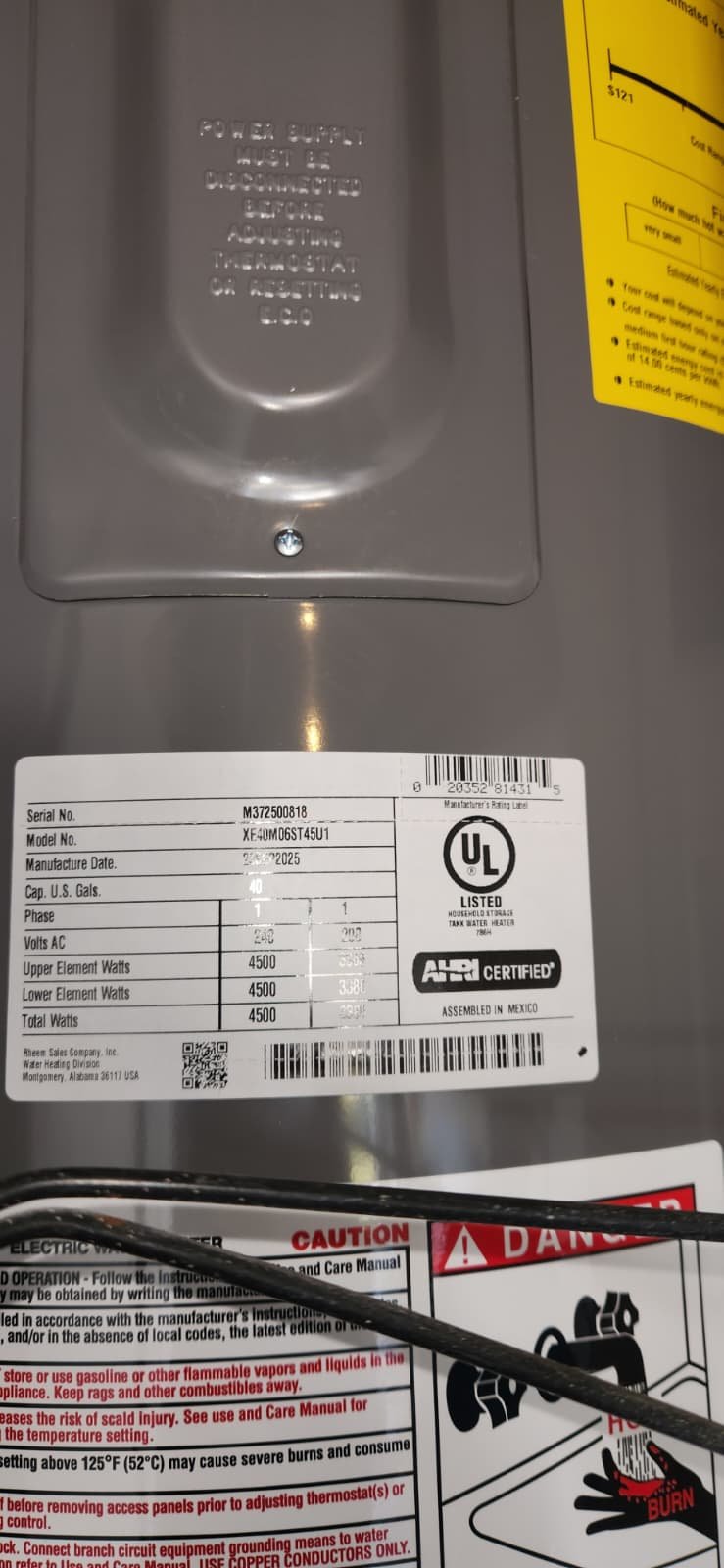 Installed Rheem tall electric water heater with drain pan in St. Petersburg, FL 33703