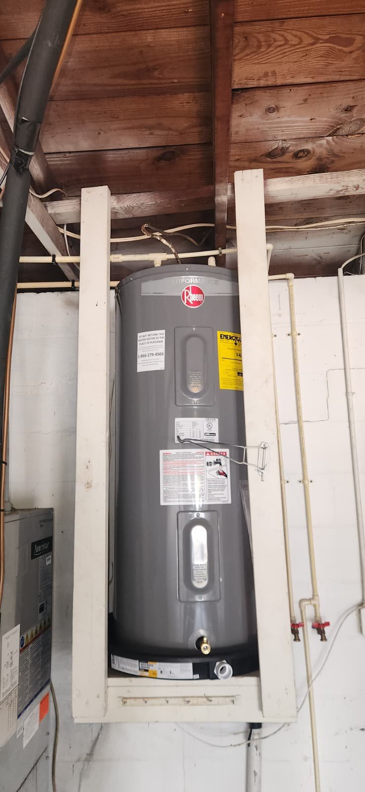 Water heater installation with discharge line and pan in St. Petersburg, FL 33703 home