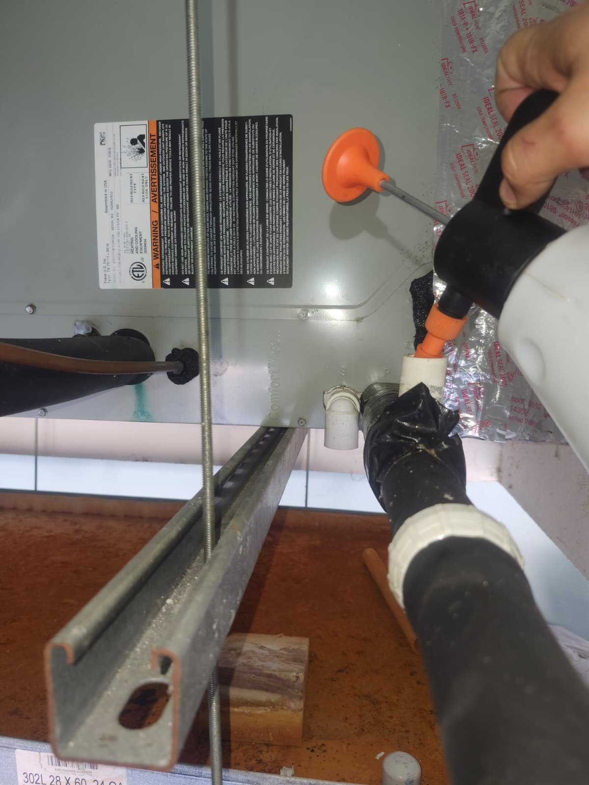 Detail of AC condenser components during plan maintenance in Odessa, FL 33556