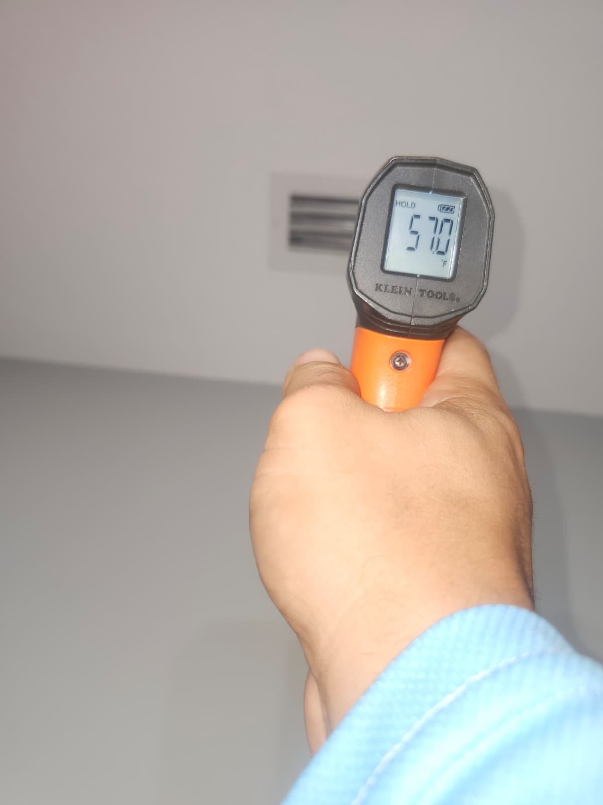 Technician servicing outdoor AC unit during maintenance in Odessa, FL 33556