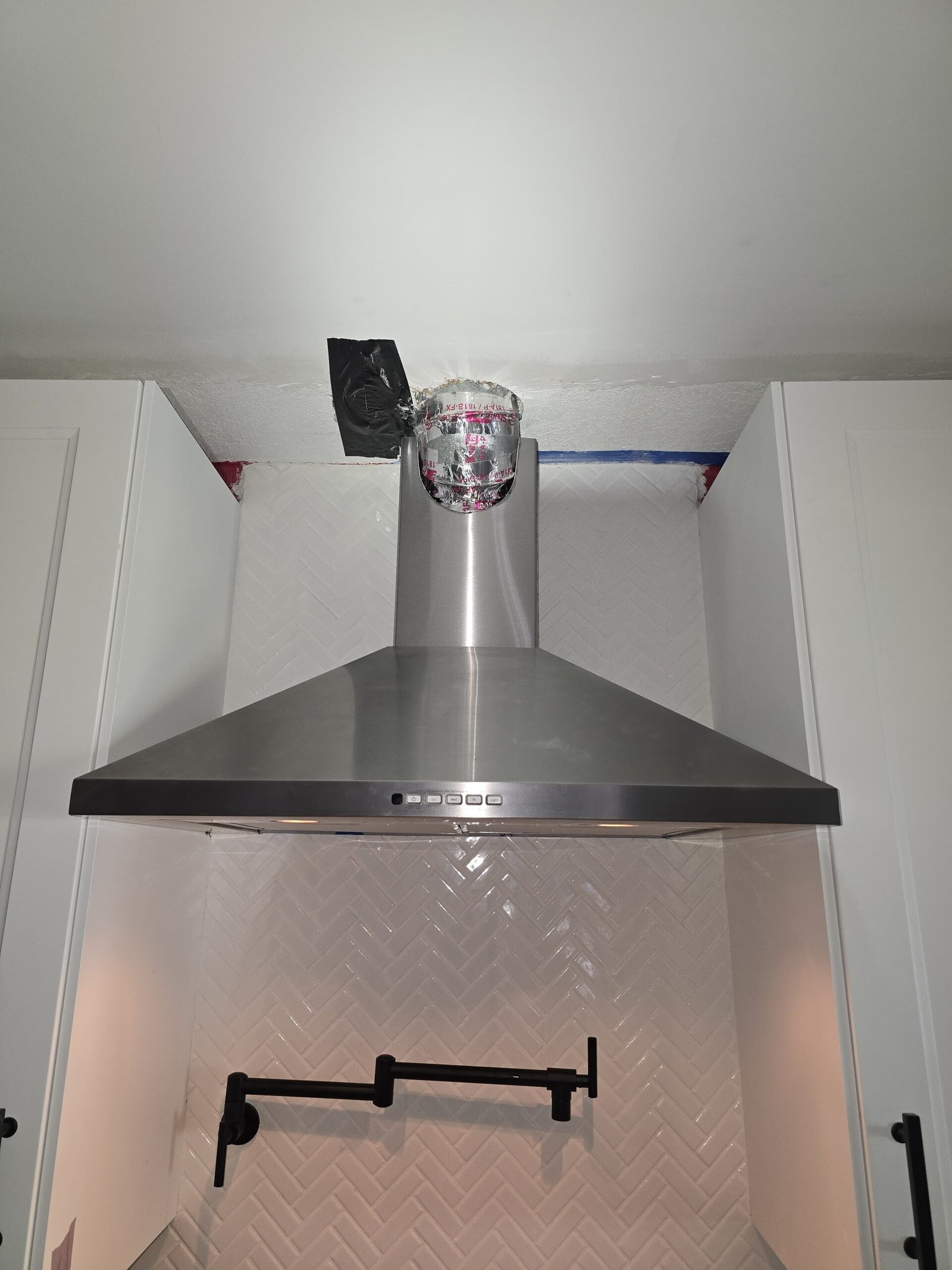 Microwave exhaust duct connection installed to code in Tampa, FL 33611