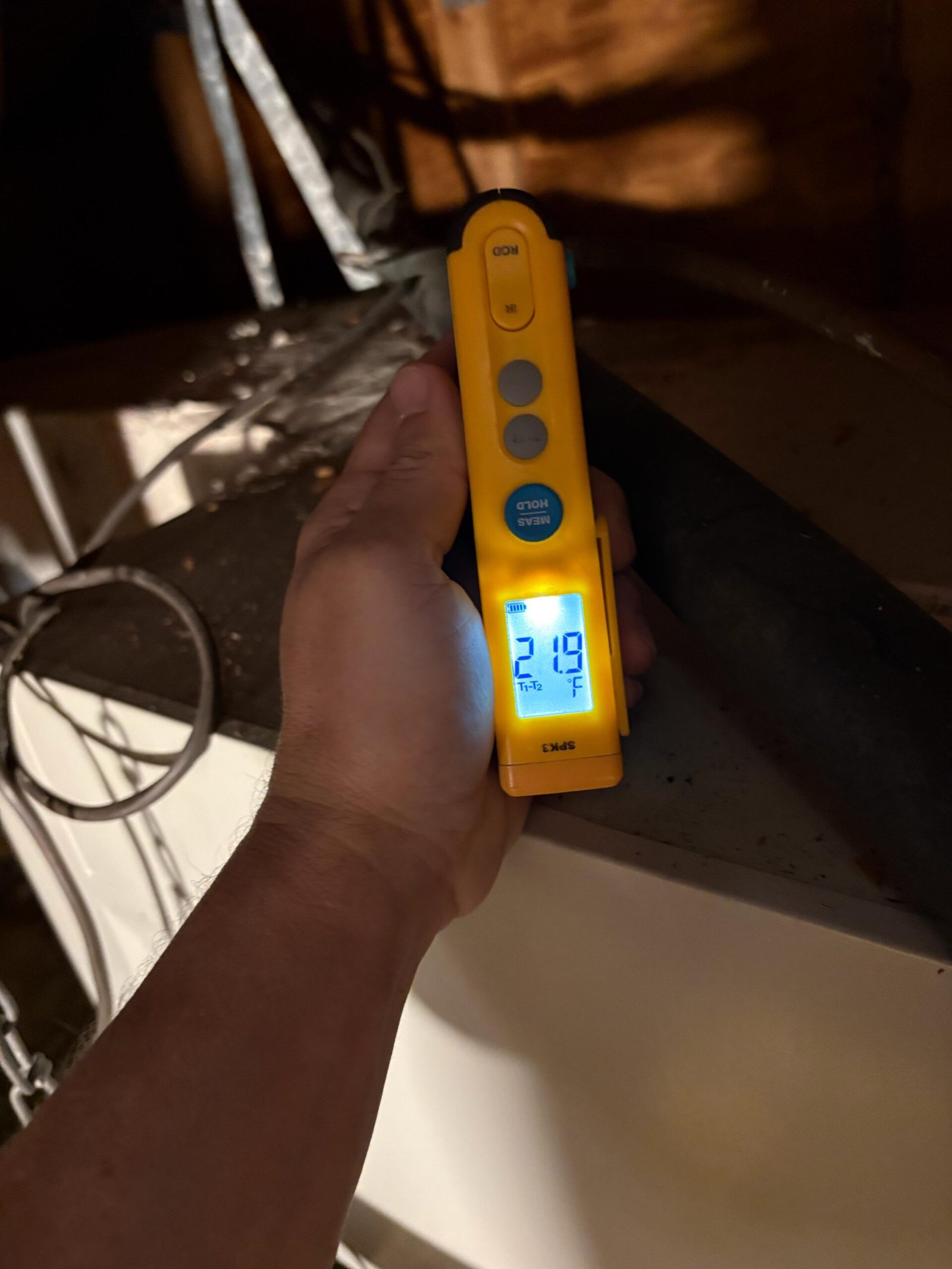 Outdoor AC condenser inspection during maintenance in Tampa, FL 33616