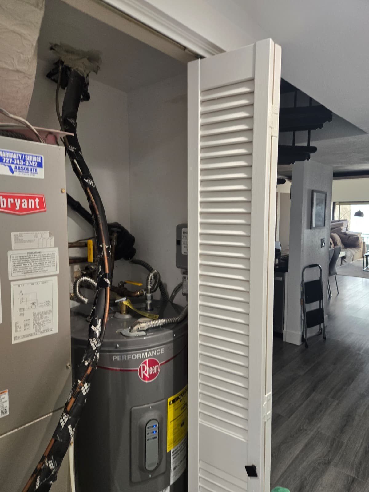 Professional water heater installation with LED control panel in Indian Shores, FL
