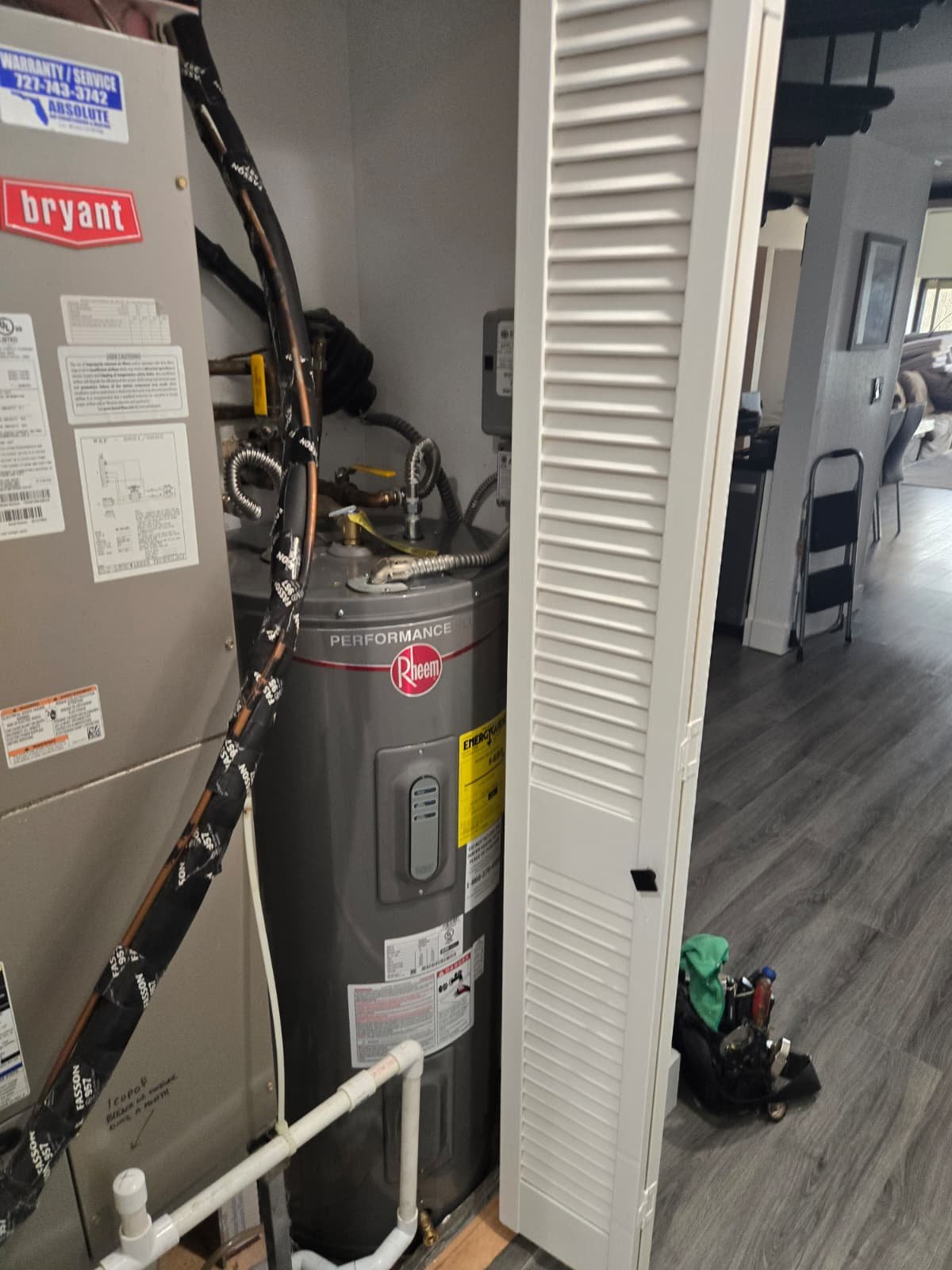Completed Rheem water heater install with labeled piping in Indian Shores, FL 33785