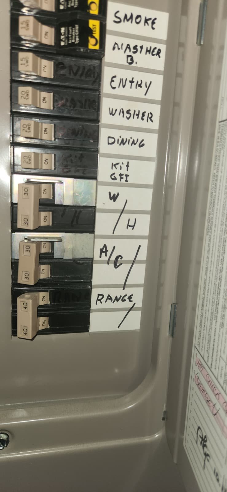 Checking water heater for rust, leaks and loose connections in Tampa, FL 33604