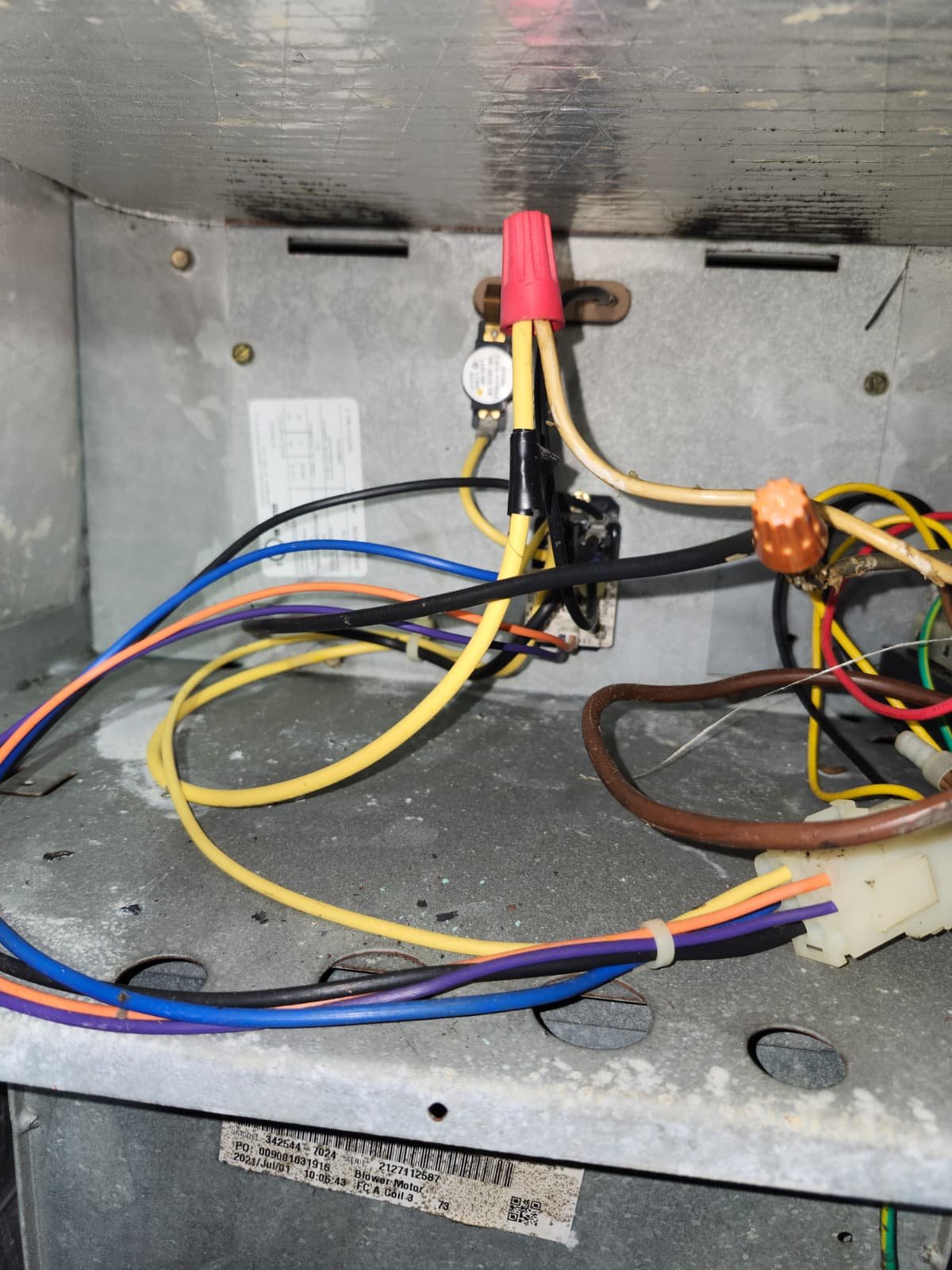 HVAC air handler panel open during relay replacement in Clearwater, FL 33755