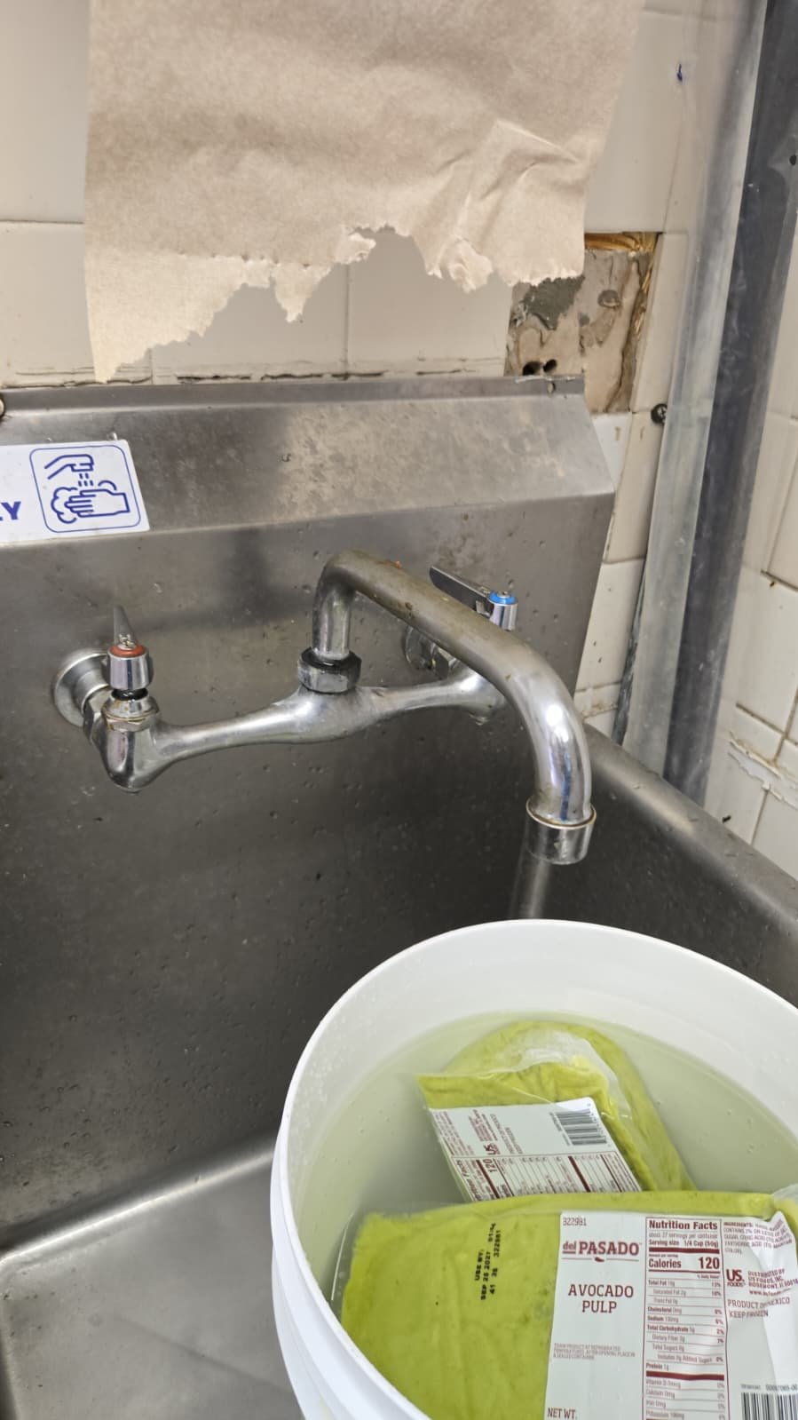 Under-sink view of new faucet supply lines in Largo, FL 33771