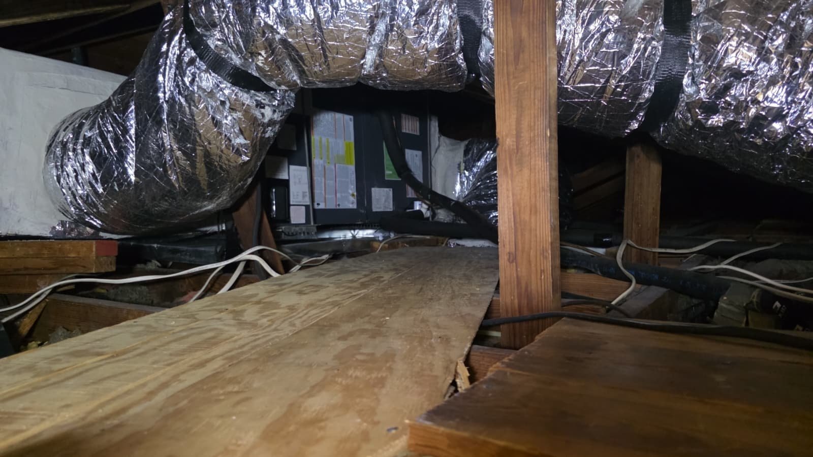 Indoor AC unit inspection during HVAC maintenance in Tampa, FL 33603