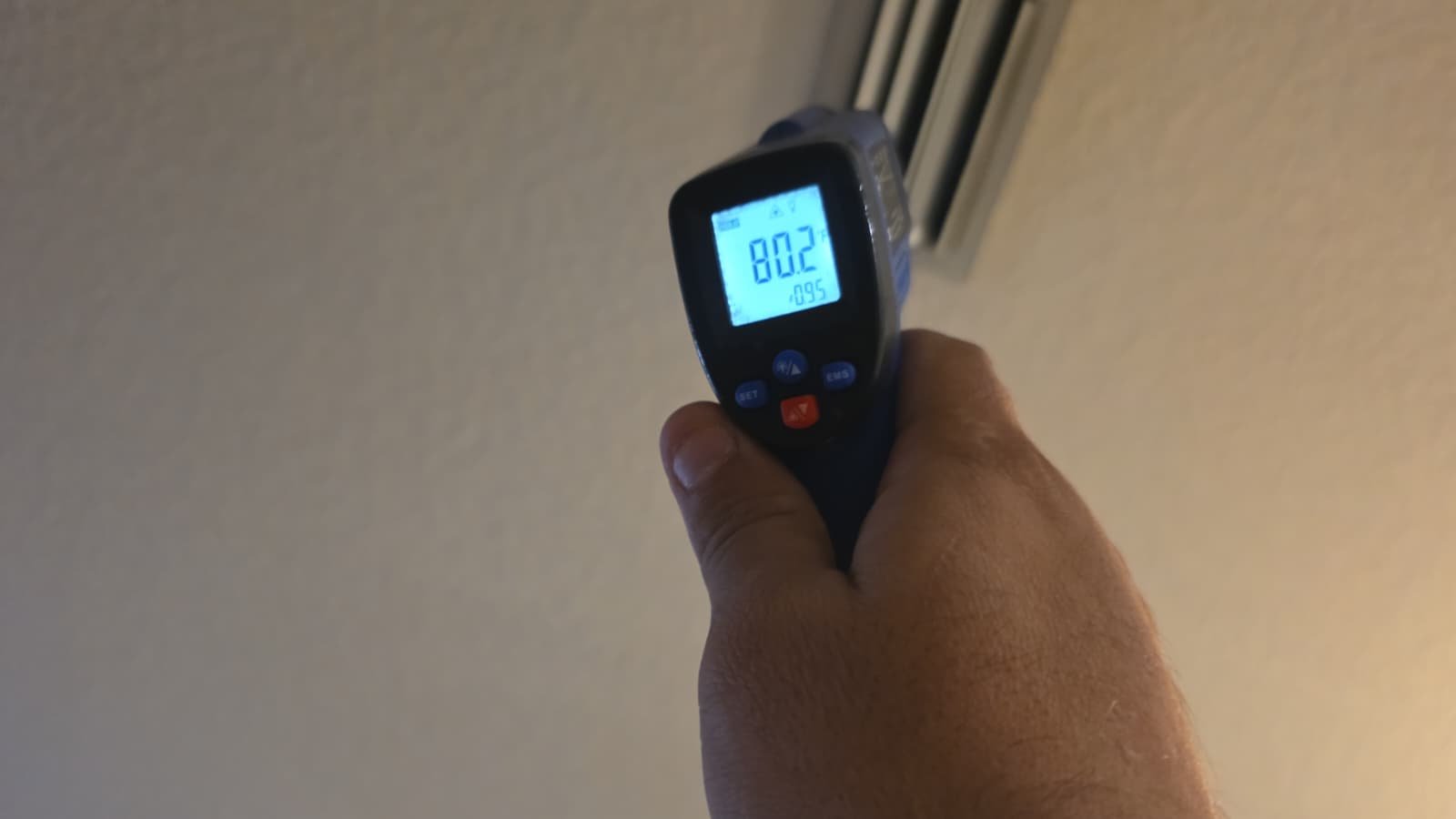 Technician verifying AC heat cycle after thermostat configuration in Tampa, FL 33625