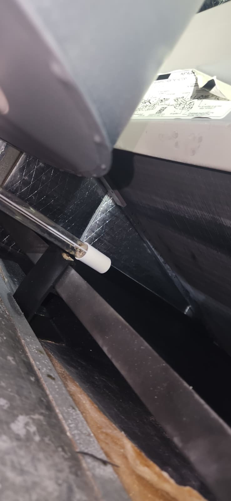 Clearwater, FL 33756 technician inspecting water heater for tune-up service