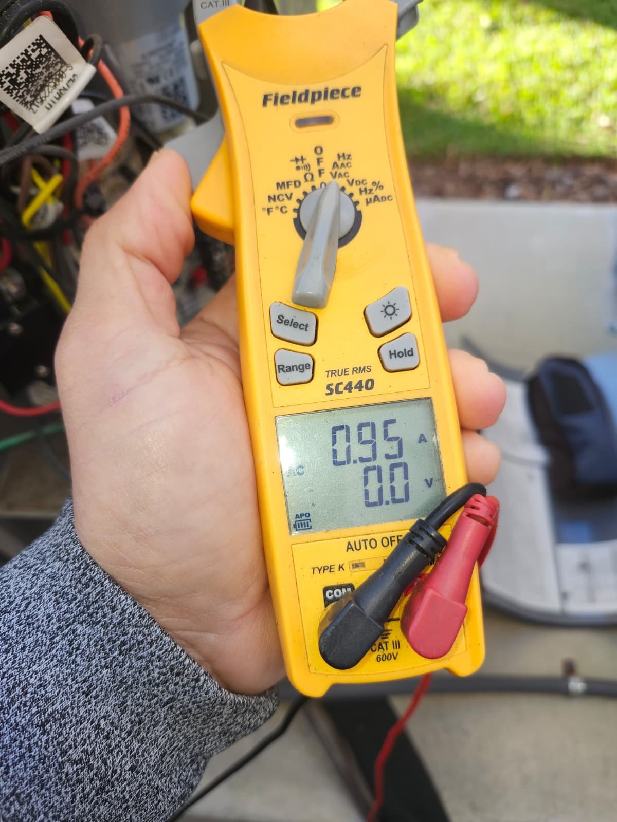 HVAC maintenance visit in Tampa, FL 33634 inspecting outdoor AC condenser unit