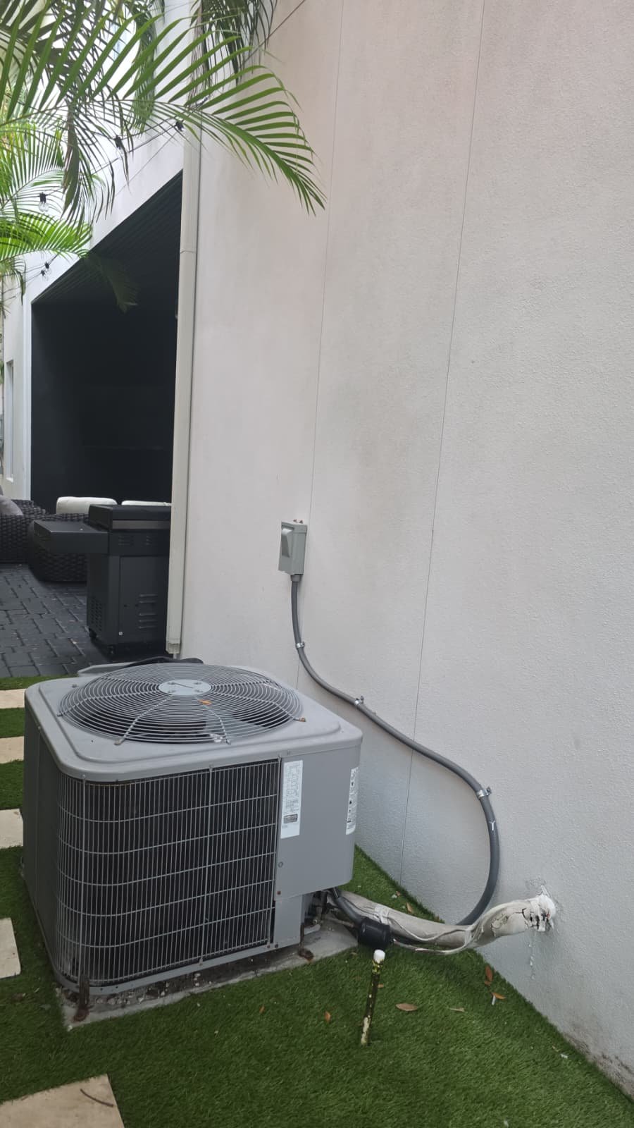Condenser relocation setup and AC tune-up work in progress in Tampa, FL 33606