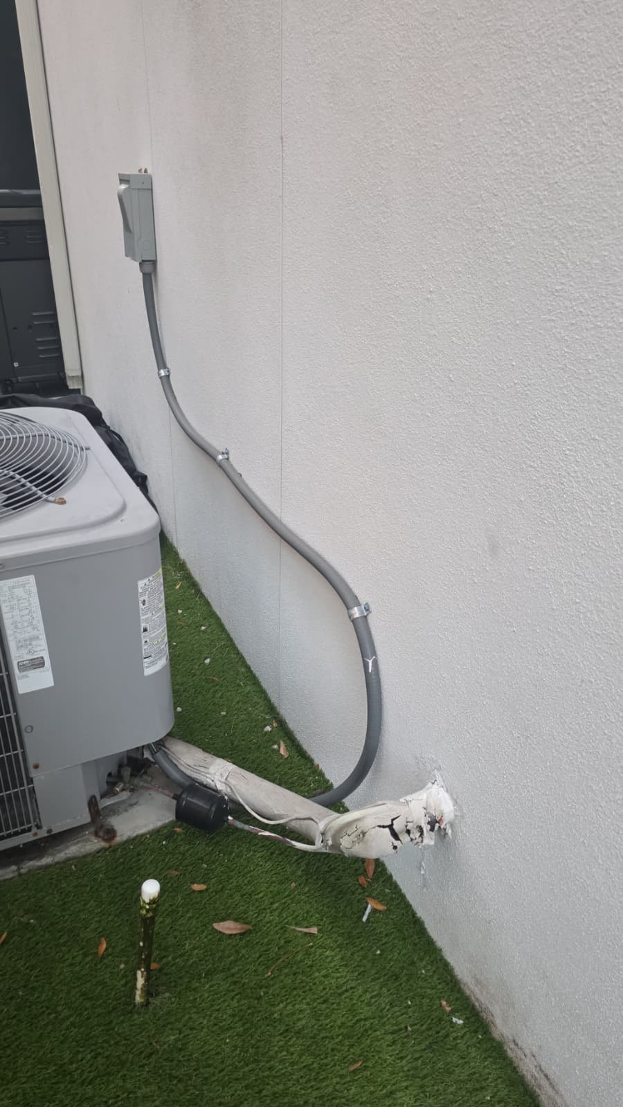 Vacuuming refrigerant lines during condenser relocation in Tampa, FL 33606