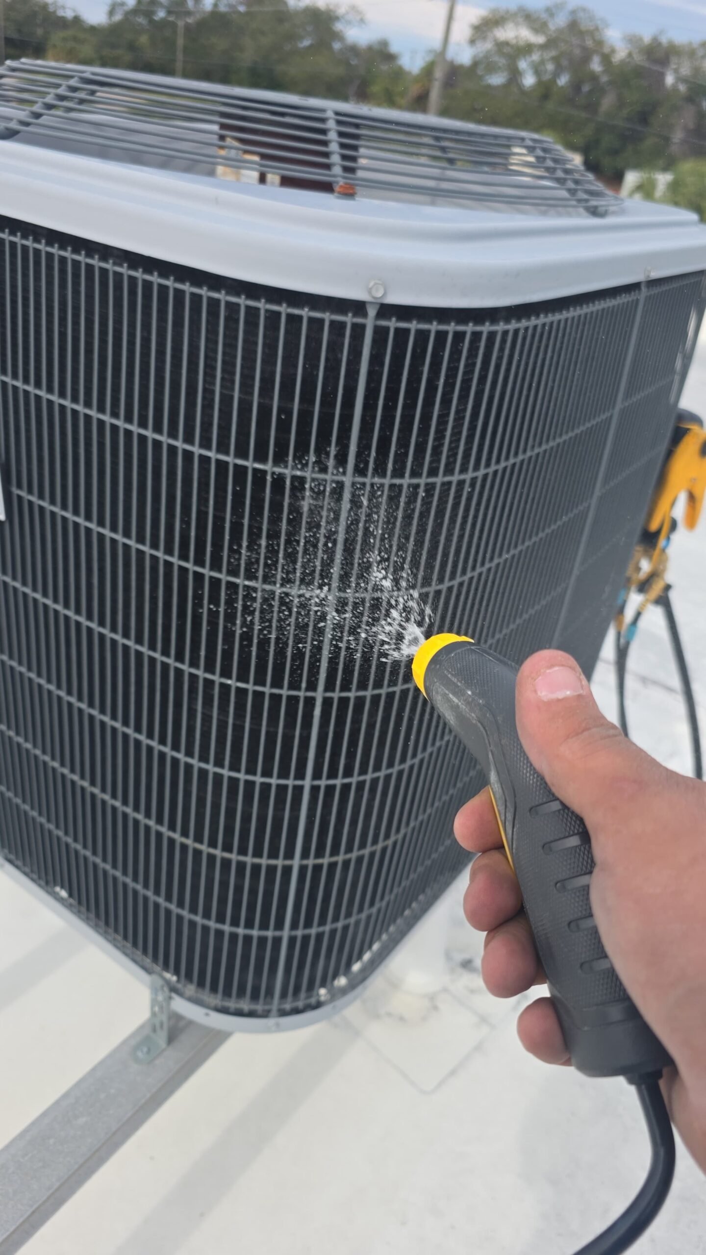 Checking refrigerant pressures during AC maintenance in Tampa, FL 33634