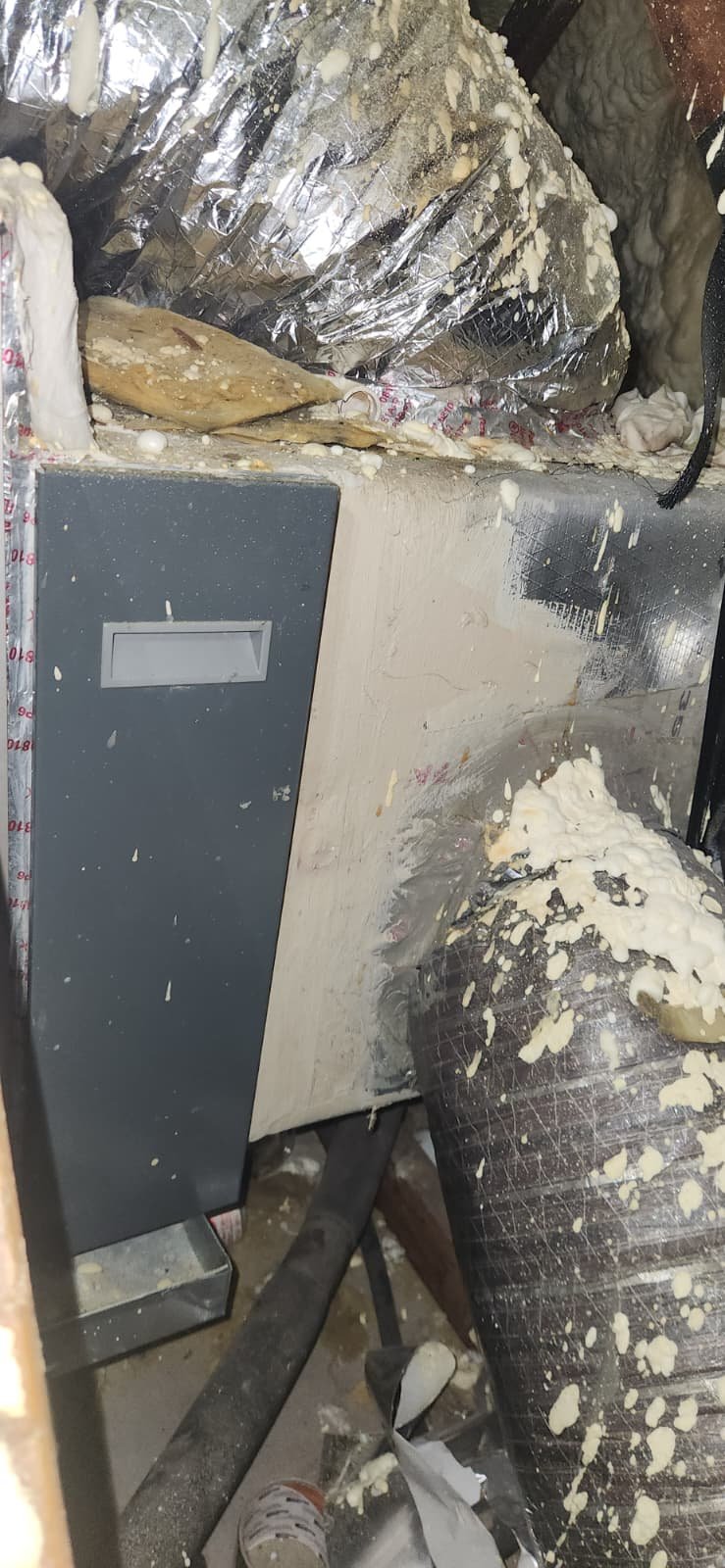 Cleaning condenser coil as part of AC maintenance in Tampa, FL 33634