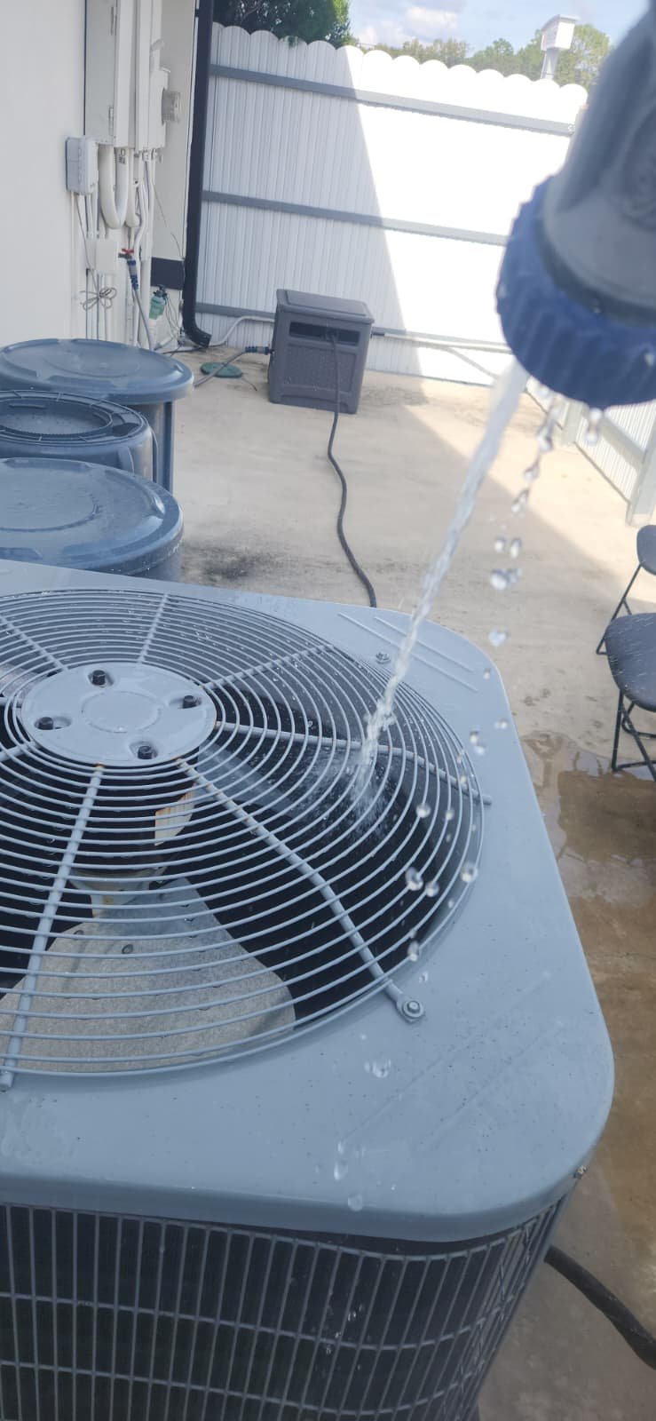 Checking electrical components during HVAC tune up in Tampa, FL 33634