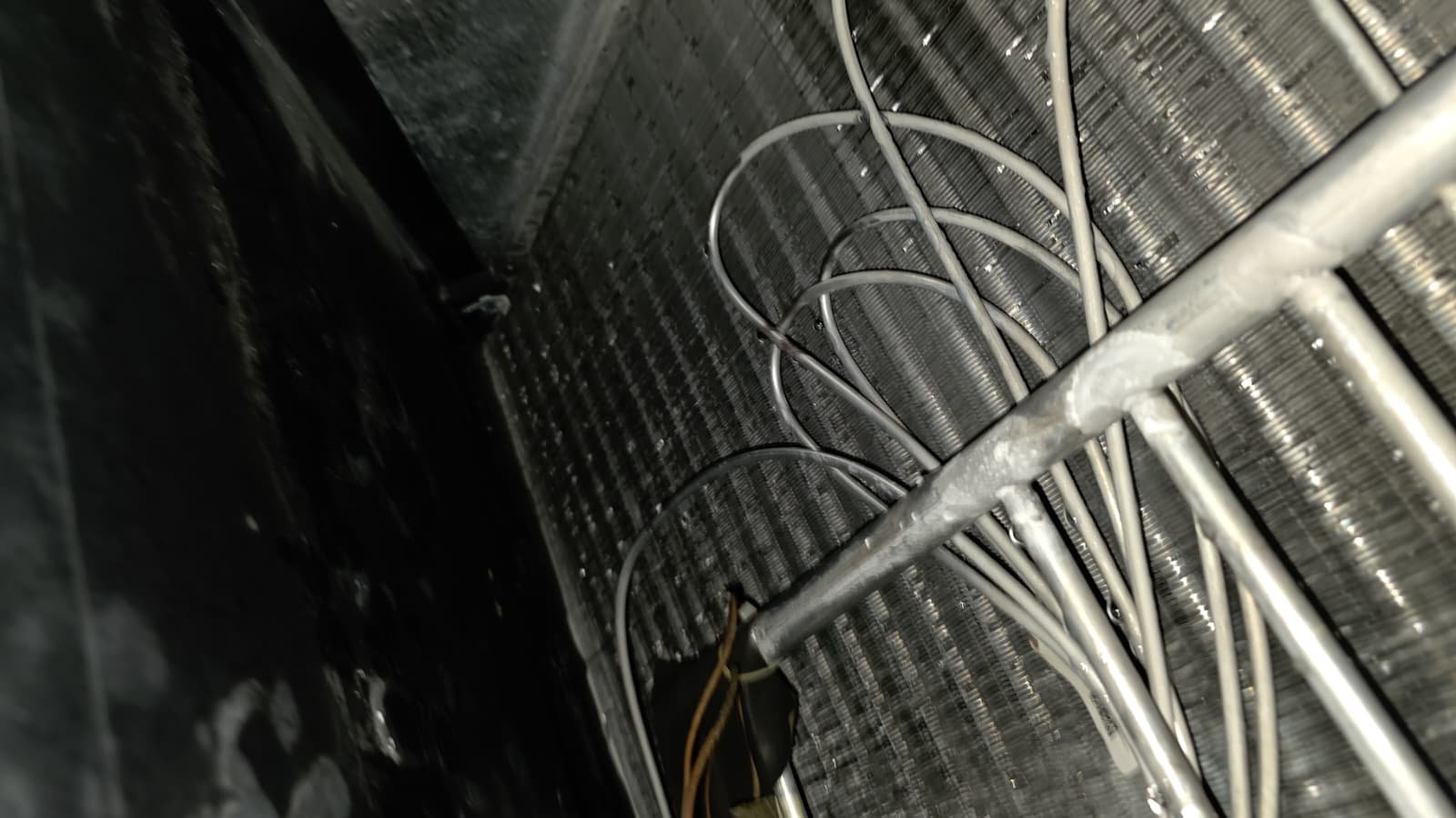 Indoor HVAC unit cleaning during premium maintenance in Wesley Chapel, FL 33545