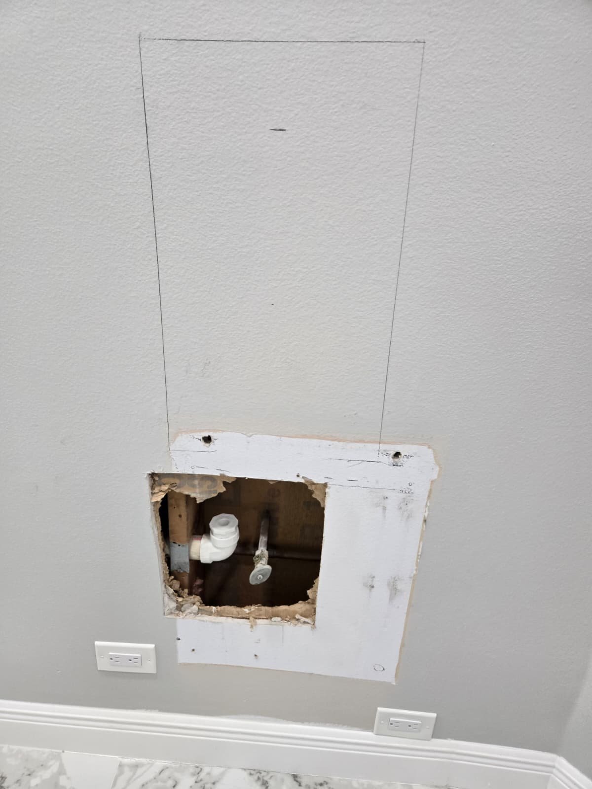 Finished recessed water dispenser hookup with hidden lines in Tampa, FL 33614