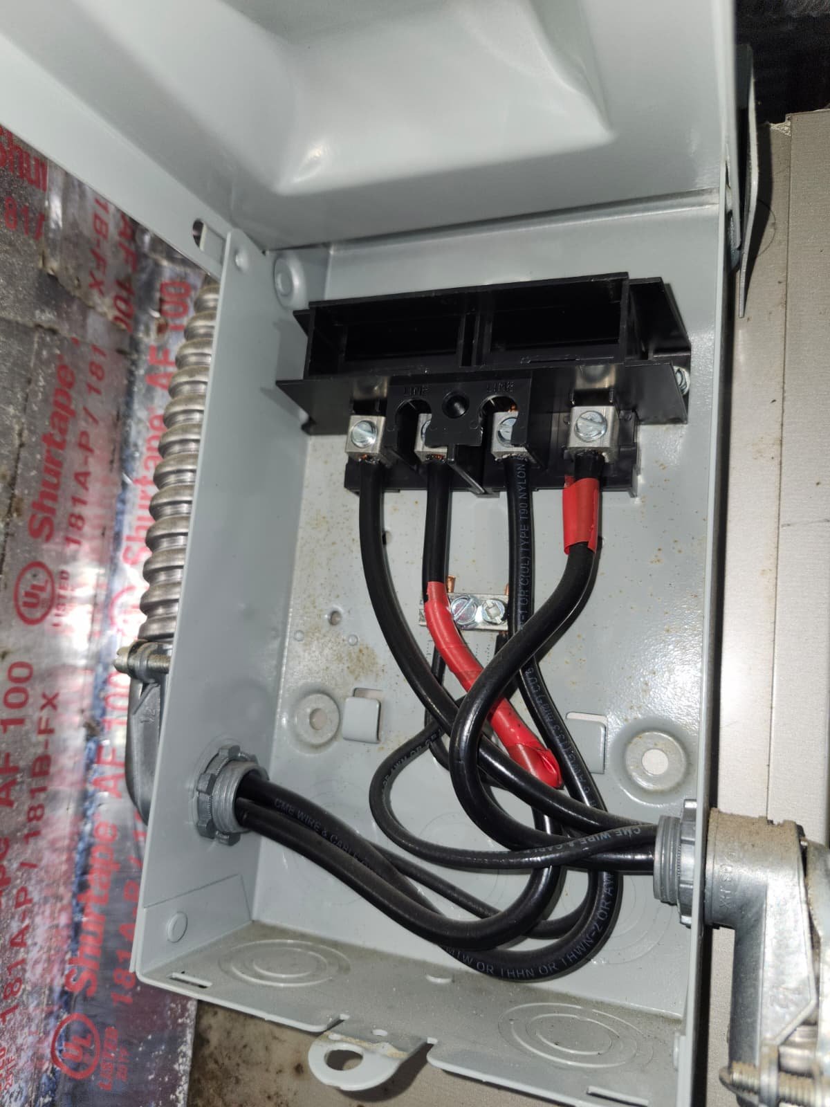 Inspecting oxidized evaporator coil during AC maintenance in Tampa, FL 33634 home