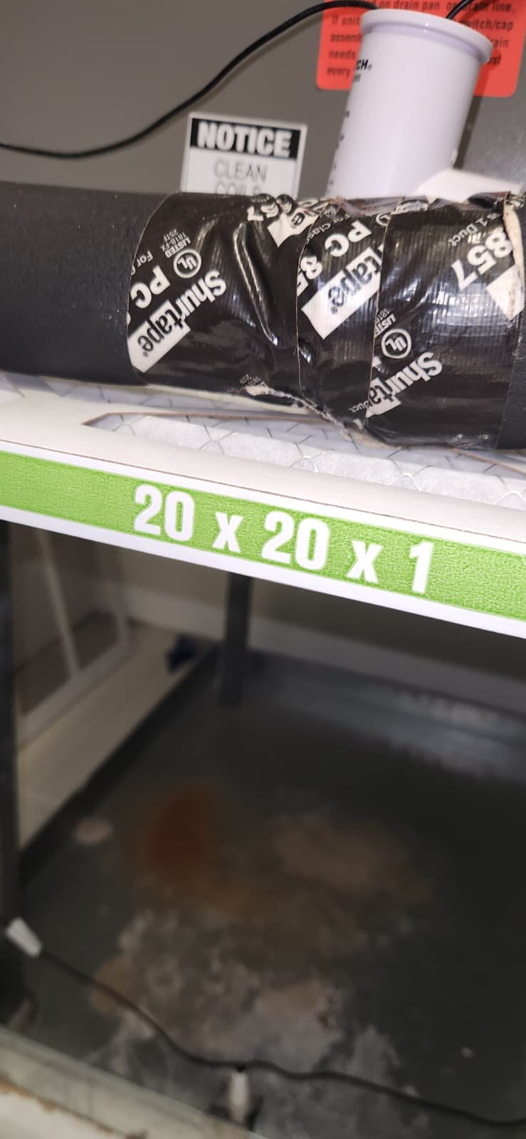 Air conditioner maintenance in Tampa, FL 33634 flushing drain line