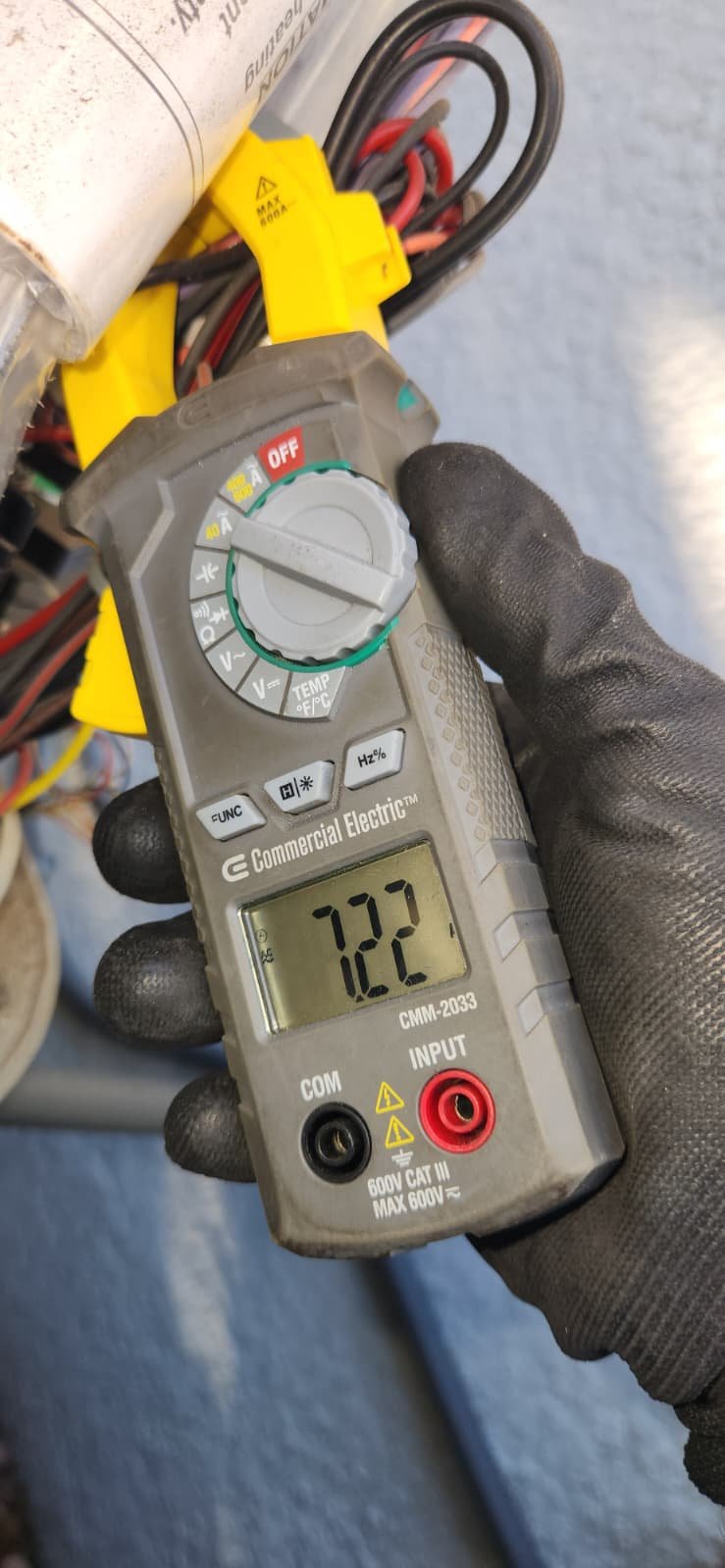 AC tune-up service in Tampa, FL 33634 inspecting condenser unit