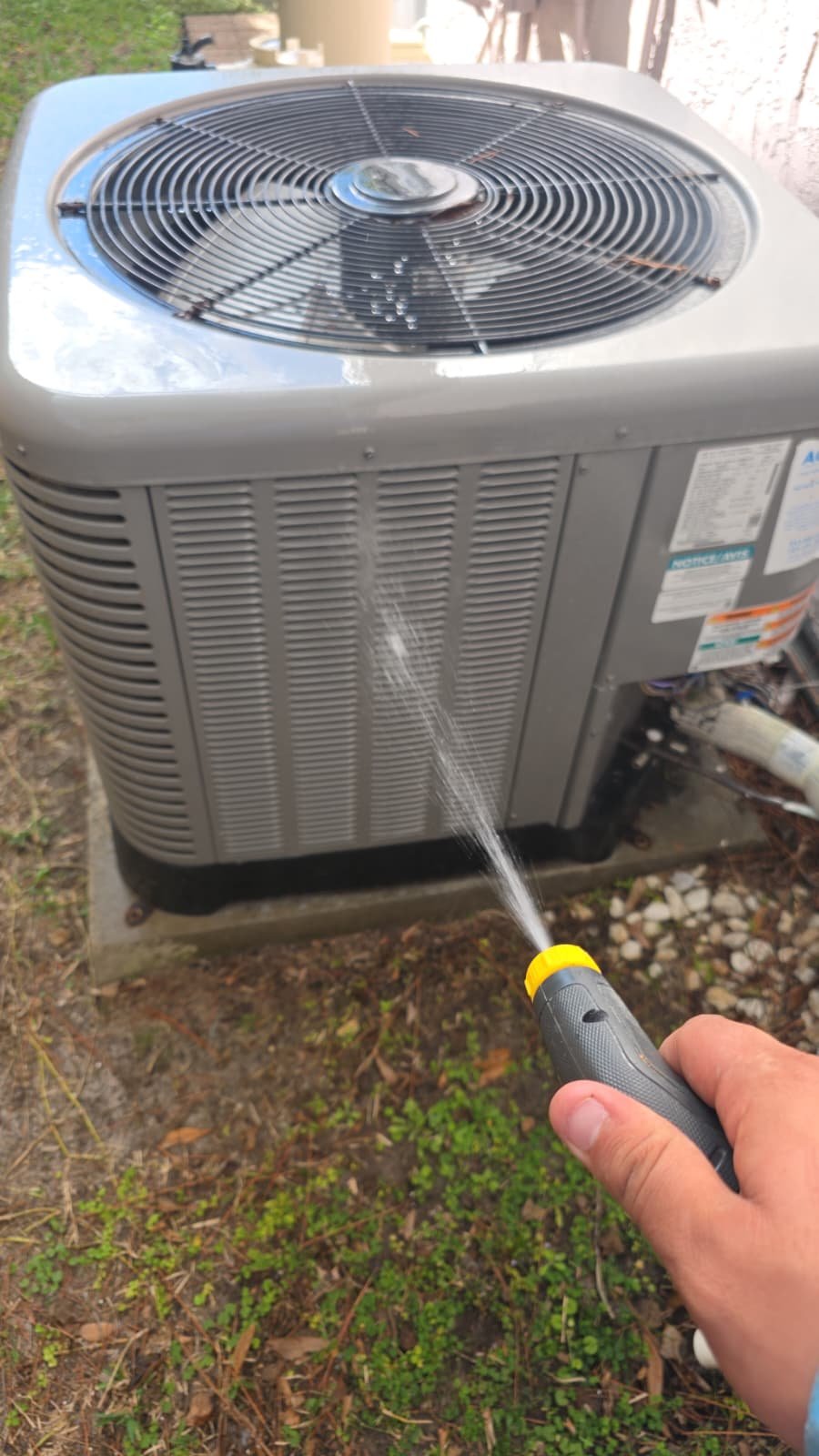 AC maintenance under Elite Plan in Tampa, FL 33624 showing indoor unit service