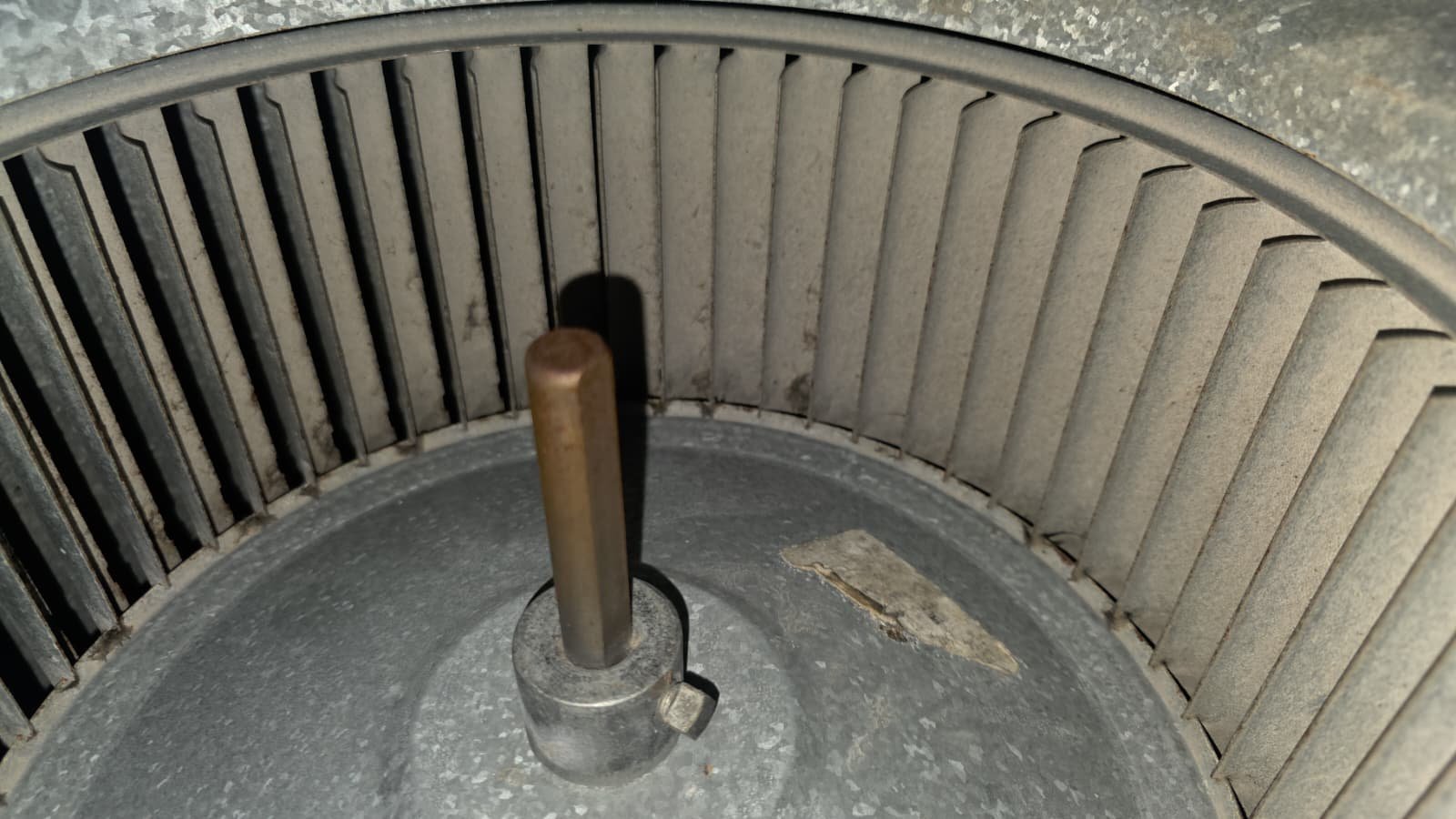 Close-up of duct insulation adjustment in Tampa, FL 33624 attic to reduce condensation