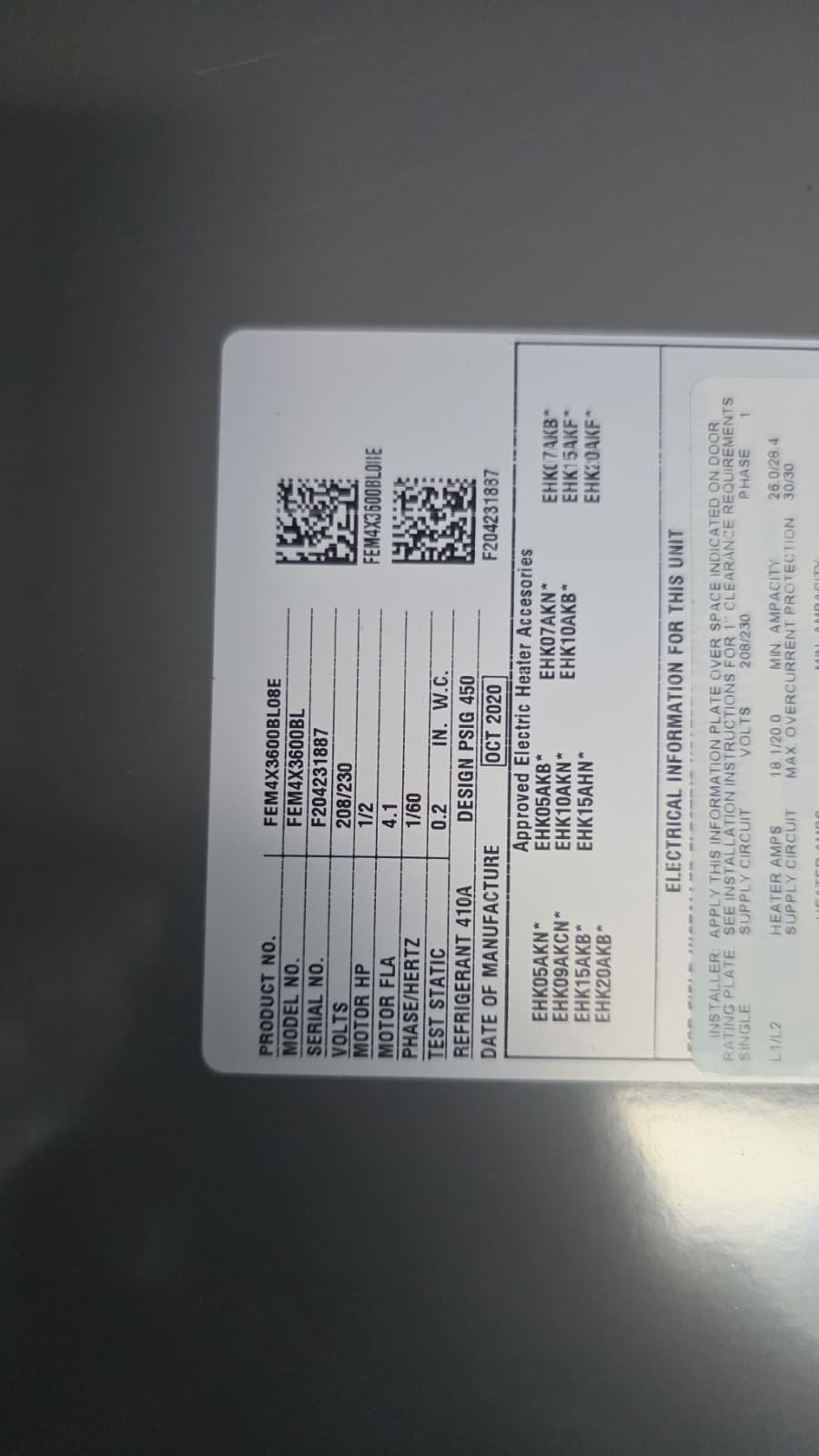 Technician installing universal 220V air handler blower in Seminole, FL 33776