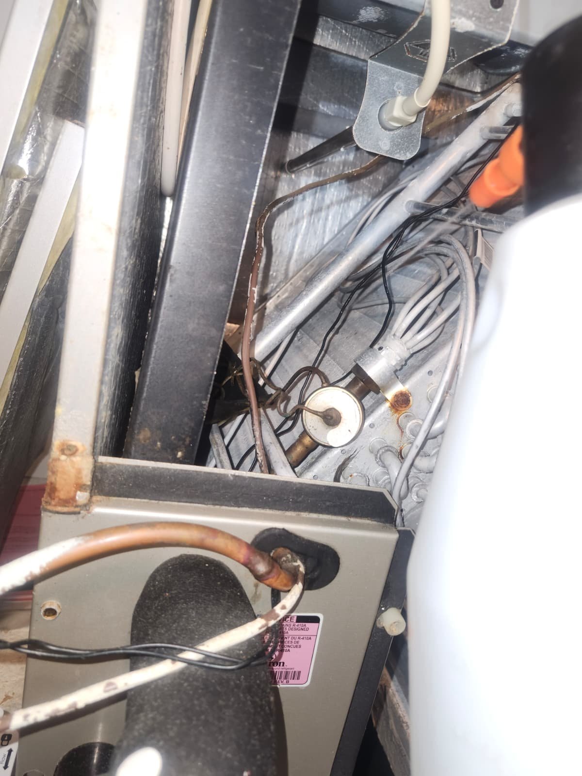 Carrier condenser inspected during Elite HVAC maintenance in Spring Hill, FL 34610