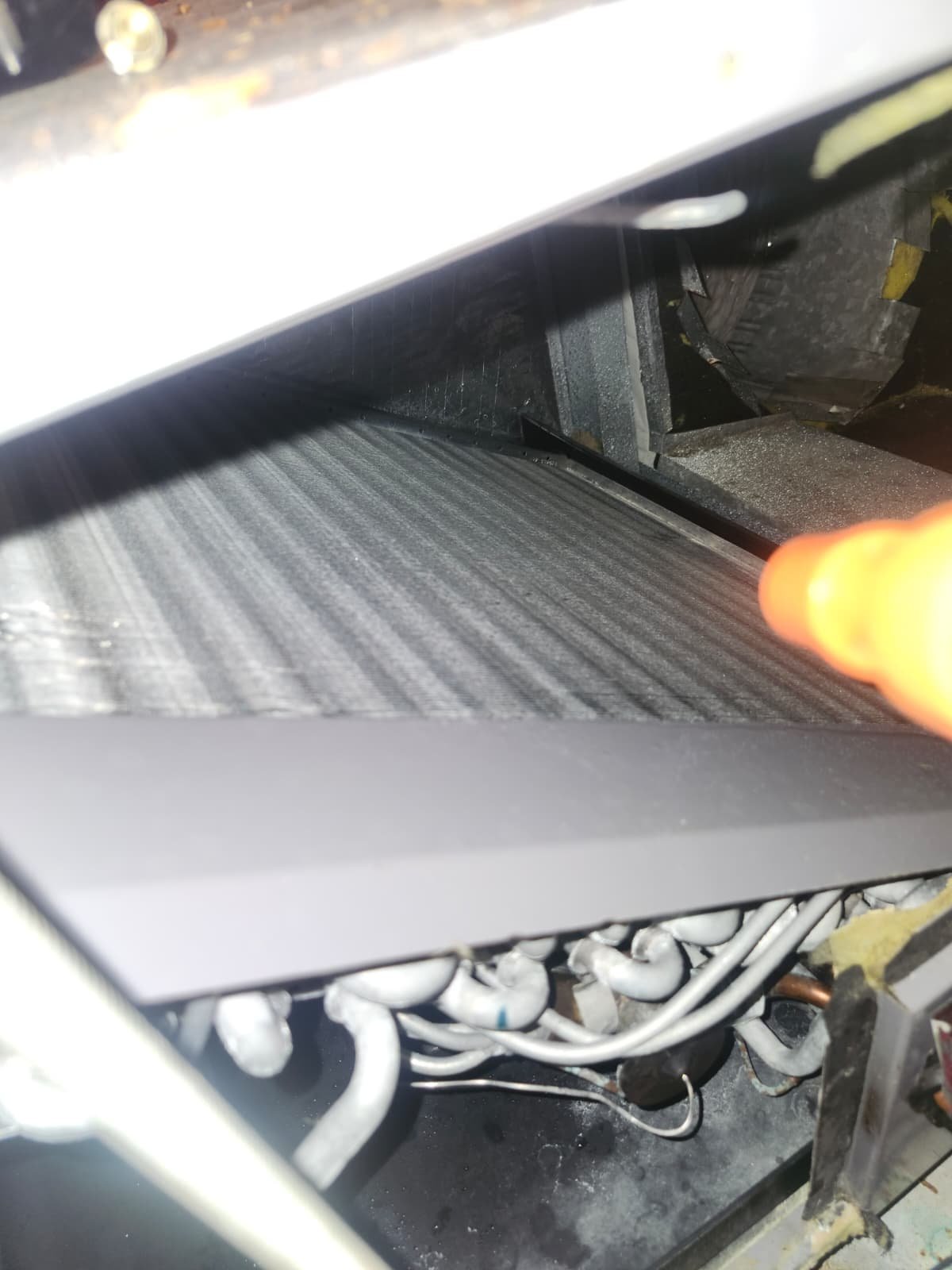 Aging fiberglass ductwork inspected during AC maintenance in Clearwater, FL 33763