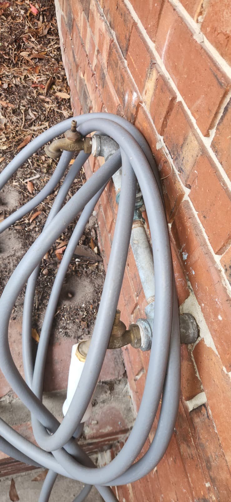 Worn exterior hose bib marked for replacement in Lakeland, FL 33801 home