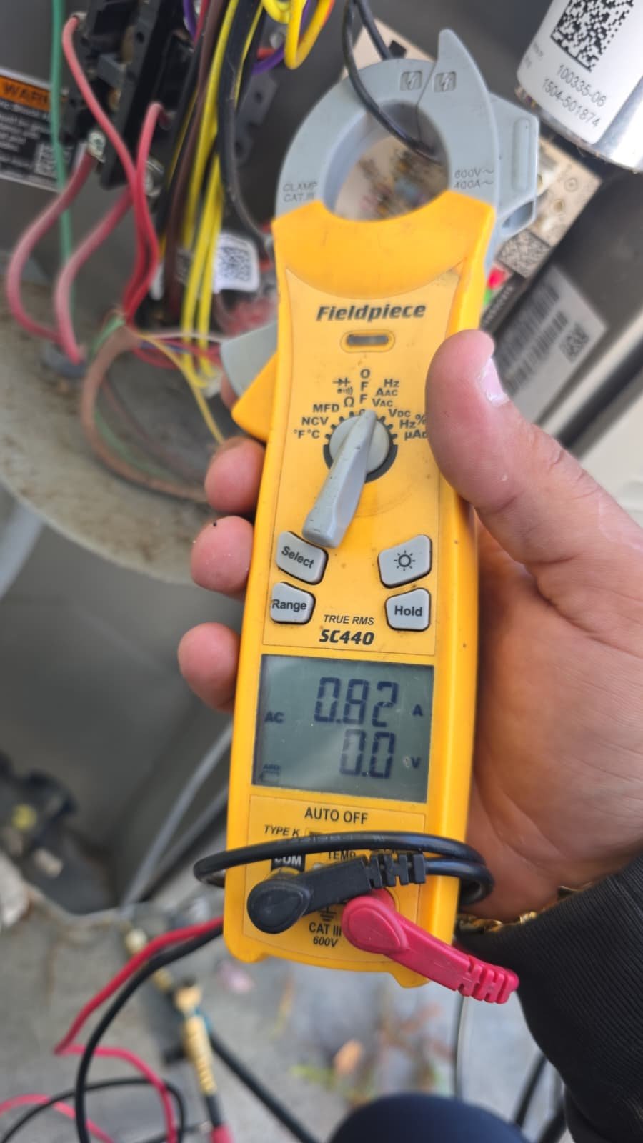 Inspection of compressor and fan during AC maintenance in Tampa, FL 33619