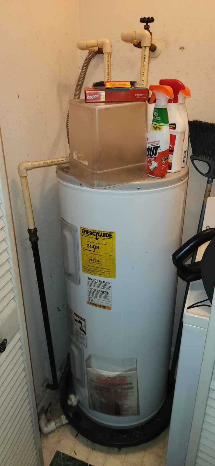 Aged water heater inspected for replacement in Tampa, FL 33604 home