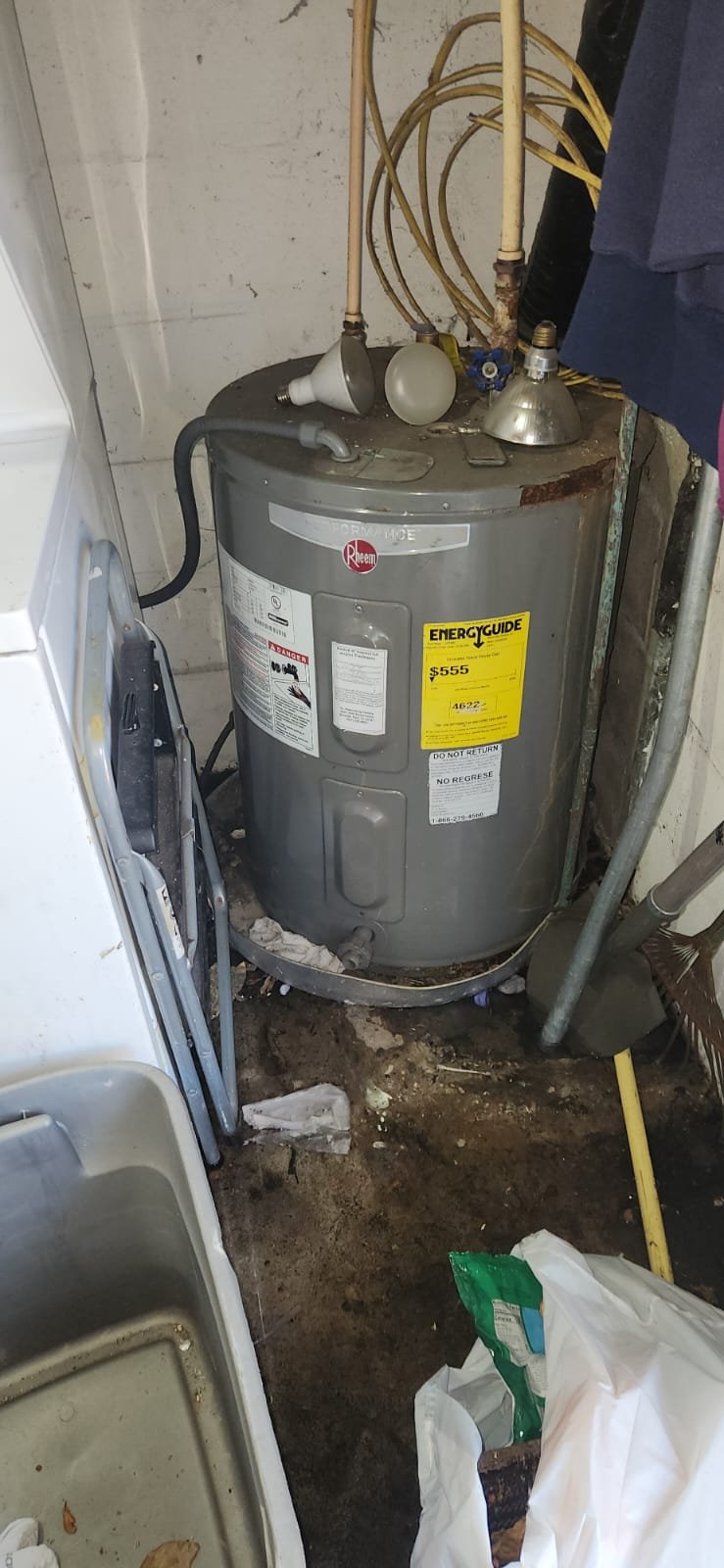 Side view of installed Rheem water heater and insulated lines in Largo, FL 33770