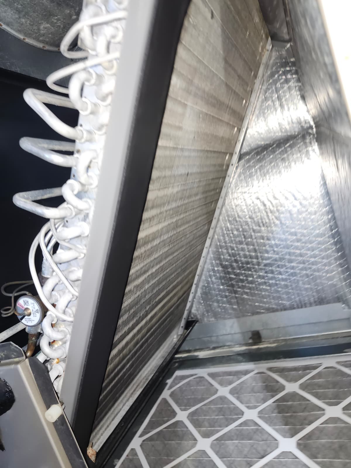 Indoor heat exchanger inspection during AC maintenance in Valrico, FL 33596