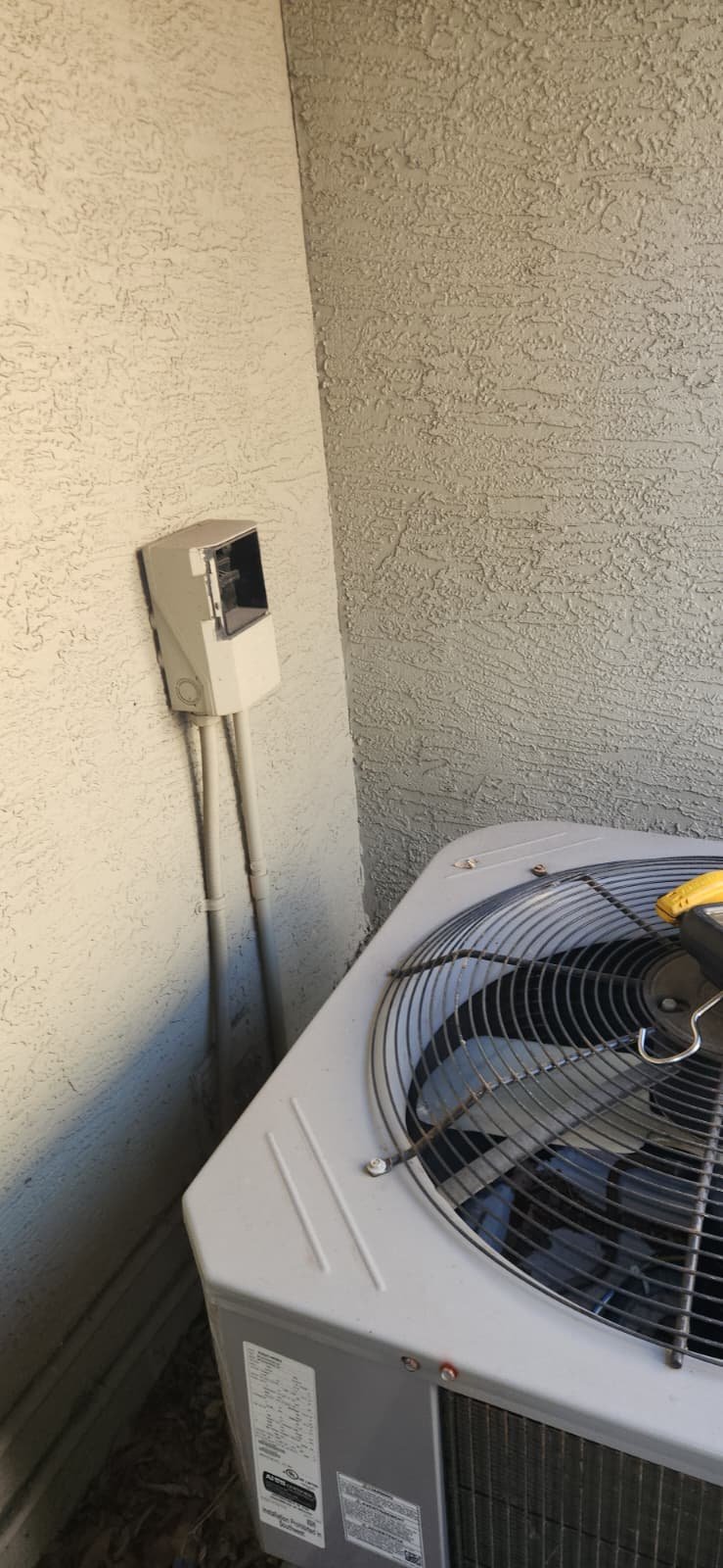Technician performing AC maintenance and tune-up in Tampa, FL 33602 home