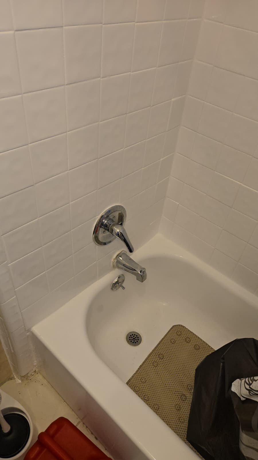 Professional drain cleaning snake setup at cleanout in Tampa, FL 33610