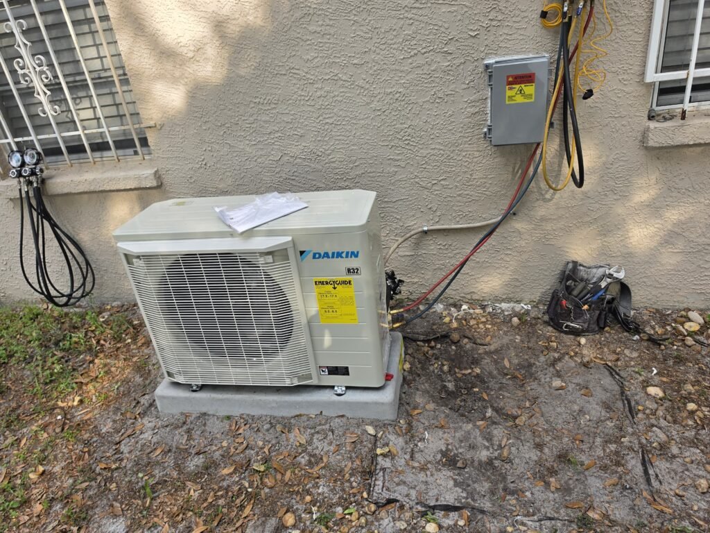 A Daikin mini-split outdoor unit installed on a pad in Tampa, FL 33624.